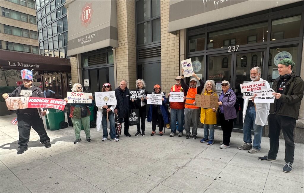 Radical Elders rally outside the midtown Manhattan Social Security office with a Radical Elders banner and signs supporting nonprofit health care