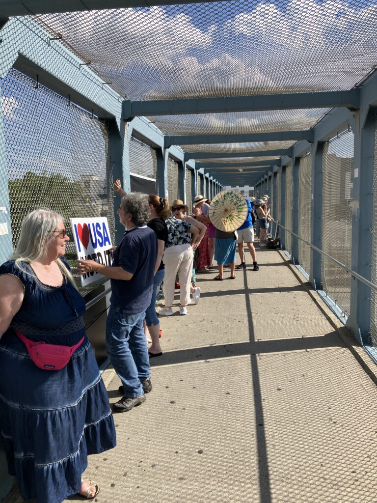 Sally and Visibility Brigade activists on the Route 4, Paramus overpass.