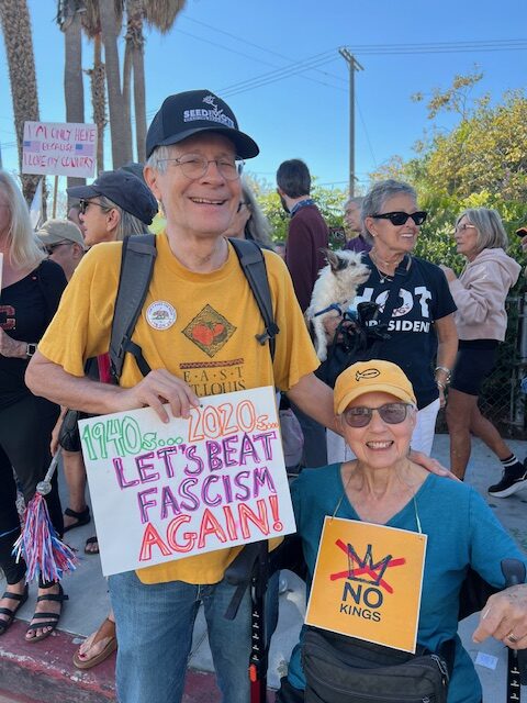 Radical Elders members holding signs reading No Kings and 1940s. . . 2020s. . . Let’s Beat Fascism Again!